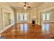 Living room with hardwood floors, built-in shelving, and fireplace at 1471 Centennial Rd, Rutledge, GA 30663