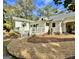 White farmhouse with wrap around porch and landscaping at 1471 Centennial Rd, Rutledge, GA 30663