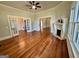 Bright living room with hardwood floors, fireplace, and French doors at 1471 Centennial Rd, Rutledge, GA 30663