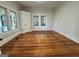 Bright living room with hardwood floors and large windows at 1471 Centennial Rd, Rutledge, GA 30663
