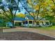 White farmhouse with large front porch, screened porch, and detached studio at 1471 Centennial Rd, Rutledge, GA 30663