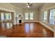 Living room with hardwood floors, fireplace, and large windows at 1471 Centennial Rd, Rutledge, GA 30663