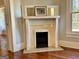Fireplace with tiled hearth and mantel, offering a cozy focal point at 1471 Centennial Rd, Rutledge, GA 30663