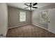Bedroom with carpeted floor, ceiling fan and two windows at 2164 Rockhaven Cir, Decatur, GA 30032