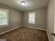 Bedroom with carpeted floors and window with blinds at 2164 Rockhaven Cir, Decatur, GA 30032