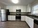 Modern kitchen with stainless steel appliances and granite countertops at 2164 Rockhaven Cir, Decatur, GA 30032