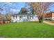 Charming ranch home with gray exterior, updated windows, and a manicured lawn at 2164 Rockhaven Cir, Decatur, GA 30032