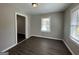 Bright dining room with hardwood floors and access to another room at 2164 Rockhaven Cir, Decatur, GA 30032