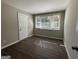 Living room featuring hardwood floors and large window at 2164 Rockhaven Cir, Decatur, GA 30032