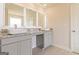 Bathroom with double vanity and granite countertops at 319 Granary Walk # 92, Covington, GA 30014