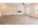 Spacious living area with hardwood floors and a fireplace at 319 Granary Walk # 92, Covington, GA 30014