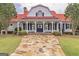 Farmhouse-style community clubhouse with red roof at 319 Granary Walk # 92, Covington, GA 30014