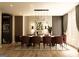 Elegant dining room featuring a large table, modern lighting, and hardwood floors at 280 Brannan Rd, Mcdonough, GA 30253