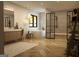 Modern bathroom with a large soaking tub, walk-in shower, and herringbone floors at 280 Brannan Rd, Mcdonough, GA 30253
