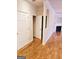 Hallway with hardwood floors and access to bedrooms and bathroom at 1402 Aramore Se Dr, Conyers, GA 30013