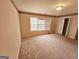 Spacious bedroom with large window, carpet flooring, and a double-door closet at 1402 Aramore Se Dr, Conyers, GA 30013