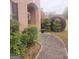 Landscaped front yard with a curved walkway to the entrance at 1402 Aramore Se Dr, Conyers, GA 30013