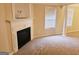 Main bedroom with fireplace and columns at 1402 Aramore Se Dr, Conyers, GA 30013