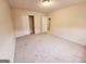 Bright bedroom with carpet and access to other rooms at 1402 Aramore Se Dr, Conyers, GA 30013