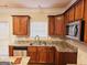 Kitchen features stainless steel appliances and wood cabinets at 1402 Aramore Se Dr, Conyers, GA 30013