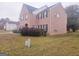 Side view of two story brick home at 1402 Aramore Se Dr, Conyers, GA 30013