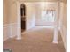 Spacious dining room with columns and neutral carpet at 1402 Aramore Se Dr, Conyers, GA 30013