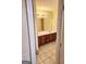Double vanity bathroom with a large mirror and tile flooring at 1402 Aramore Se Dr, Conyers, GA 30013
