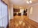 Open concept living room and kitchen with hardwood floors at 1402 Aramore Se Dr, Conyers, GA 30013