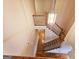 Elegant staircase with hardwood floors and a light fixture at 1402 Aramore Se Dr, Conyers, GA 30013