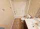 Simple bathroom with a shower/tub and single vanity at 1402 Aramore Se Dr, Conyers, GA 30013