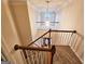 Elegant staircase with wooden railings and open loft at 1402 Aramore Se Dr, Conyers, GA 30013