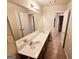 Bathroom with double vanity and access to other rooms at 1402 Aramore Se Dr, Conyers, GA 30013