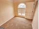 Bright bedroom featuring carpet and a window with blinds at 1402 Aramore Se Dr, Conyers, GA 30013
