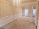 Bright dining room with chandelier and neutral decor at 1402 Aramore Se Dr, Conyers, GA 30013