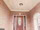 Front porch with a wooden door and brick exterior at 1402 Aramore Se Dr, Conyers, GA 30013