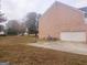 Brick home with a basketball court, playset, and attached garage at 1402 Aramore Se Dr, Conyers, GA 30013