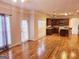 Open concept living area with hardwood floors and kitchen views at 1402 Aramore Se Dr, Conyers, GA 30013