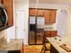 Spacious kitchen with stainless steel appliances and ample cabinetry at 1402 Aramore Se Dr, Conyers, GA 30013