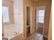 Bathroom that includes a toilet and access to other rooms at 1402 Aramore Se Dr, Conyers, GA 30013