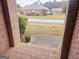 Front porch view with brick pillars and a street view at 1402 Aramore Se Dr, Conyers, GA 30013