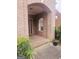 Brick front porch with a wooden door and arched window at 1402 Aramore Se Dr, Conyers, GA 30013
