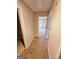 Hallway with carpet and doors to bedrooms and bathroom at 1402 Aramore Se Dr, Conyers, GA 30013
