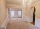 Formal dining room with chandelier and large windows at 1402 Aramore Se Dr, Conyers, GA 30013