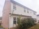 Rear view of two story home with vinyl siding at 1402 Aramore Se Dr, Conyers, GA 30013