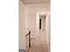 Carpeted hallway with access to bedrooms at 1402 Aramore Se Dr, Conyers, GA 30013