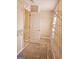 Spacious walk-in closet with built-in shelving and rods at 1402 Aramore Se Dr, Conyers, GA 30013