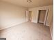 Bright and airy bedroom with carpet and an interior door at 1402 Aramore Se Dr, Conyers, GA 30013