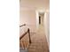 Upstairs hallway with carpeted flooring at 1402 Aramore Se Dr, Conyers, GA 30013