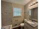 Updated bathroom with granite vanity and marble shower surround at 3107 Cherry Blossom Ln, East Point, GA 30344