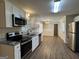Updated kitchen with stainless steel appliances and granite countertops at 3107 Cherry Blossom Ln, East Point, GA 30344